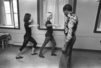The pop group ABBA. Its two female members Anni-Frid Lyngstad and Agnetha Fältskog practice and