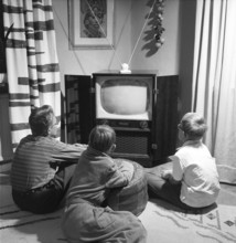 Television set in the 1950s. An early television set in period design wooden cabinett with only the