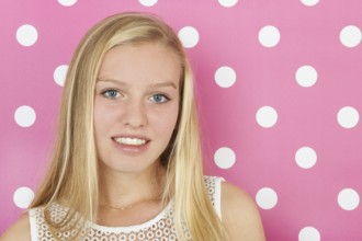 Studio portrait blond teen girl