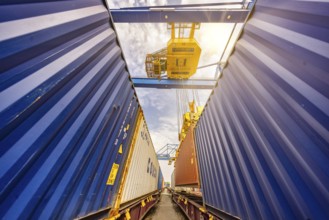 Crane loading containers onto a train in the Port of Duisburg, Terminal D3T, Logport l, Rhine,