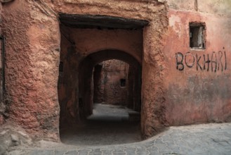 A low narrow public passage in the medina of Marrakech, Morocco