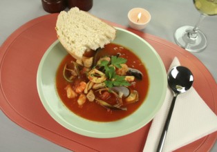 Delicious Mediterranean style tomato seafood soup with a variety of mixed seafood