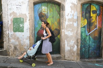 Tourist walking in the colorful historic district of Pelourinho, Bahia, Brazil. Historic