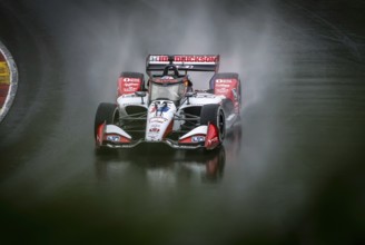 GRAHAM RAHAL (15) of New Albany, Ohio comes through turn 12 (Canada Corner) during a wet practice