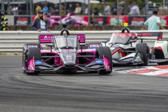 INDYCAR Series driver, HELIO CASTRONEVES (06) of Sao Paulo, Brazil, races through the turns during