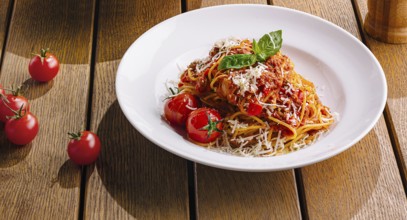 Food, Pasta dish beautifully presented on a warm, wood table setting, evoking a cozy italian dining