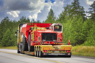 Yellow Volvo FH16 semi trailer Mantyla E&E Ky hauls Sandvik underground truck for mining operations