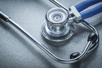 Auscultator on grey background medicine concept