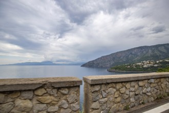 Coastal landscape shot. View from a road leading along the sea and through a breathtaking green