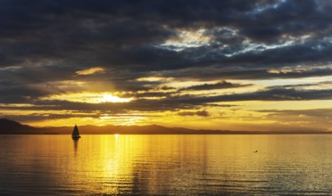 A Saisling Boat in Sunset at the City Lindau at the Lake Constance, Bavaria, Germany