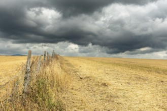 Countryside landscape under threatening sky. Aubrac France