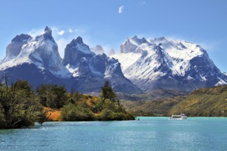 National Park Torres del Paine, Chile. Azure Lake Pehoe at the foot of the magnificent snow-covered