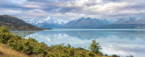 Scenic reflection of Mount Sefton and Mount Cook at lake Pukaki, South Island of New Zealand