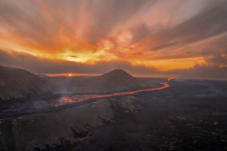 Drone image of a volcanic eruption in the evening light in Grindavik, Sudurnes, Iceland