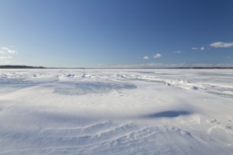 Nature, frozen riverscape with snow drifts, Province of Quebec, Canada