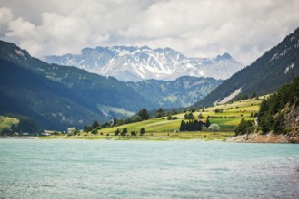 An image of the church tower in the Reschensee Italy