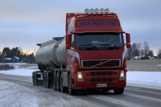 SALO, FINLAND, JANUARY 15, 2017: Red Volvo FH tank truck for bulk transport delivers a load along