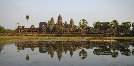 Panoramic scenery of angkor wat complex reflected on lake in the morning. Siem reap Campodia Asia