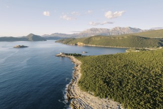 Lustica peninsula against the backdrop of mountains and the Arza fortress. Montenegro.