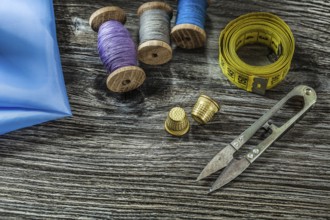 Metal scissors thimbles spool threads measure tape