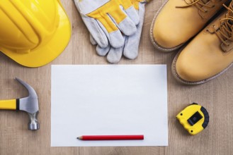 Blank sheet of paper with pencil tape measure claw hammer helmet protective gloves work boots