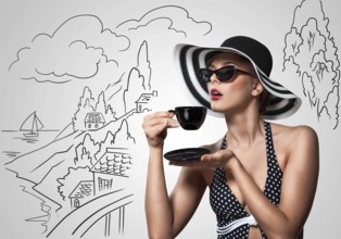 Creative vintage photo of a beautiful pin up girl drinking tea on sketchy landscape background