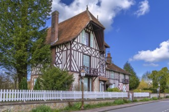 Street with historical half-timbered houses in Beuvron-en-Auge, France