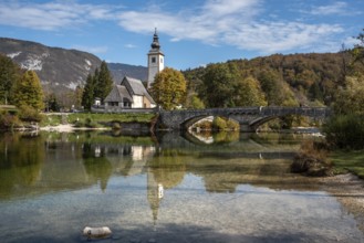 Old church St. John the Baptist at Lake Bohinj in the Triglav National Park, The Julian Alps,