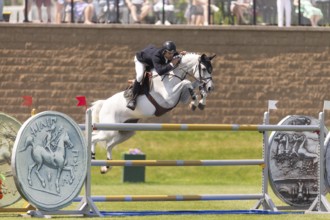Eugenio Garza Perez of Mexico and riding Contago, compete in the 1.60m Grand Prix during The