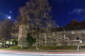 Moonlight over the wall of Göß Abbey, traces of light, former convent of the Benedictine nuns, blue