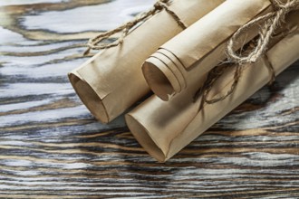 Medieval corded paper rolls on wooden board