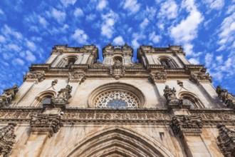 Portugal. Clock on the facade of the Catholic Cathedral of Alcobaça
