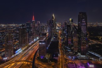 A picture of the tall buildings at the Trade Centre district at night