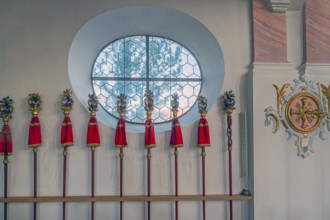 Processional poles in the rococo church of St Ulrich, affectionately known as -the little meadow-,