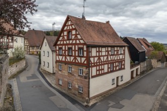 Street in Cadolsburg with half-timbered house, Bavaria, Germany