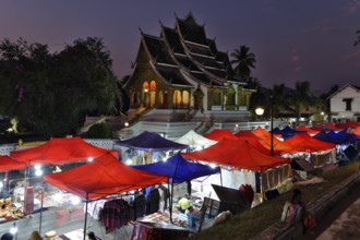 Night market in front of the Buddhist temple Haw Phra Bang of the Royal Palace, National Museum on