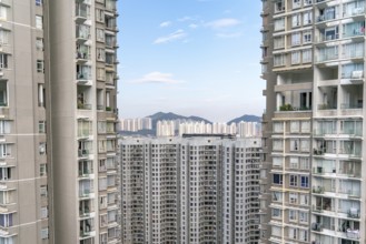 The view of residential neighborhood and skyscrapers from rooftop in Hong Kong
