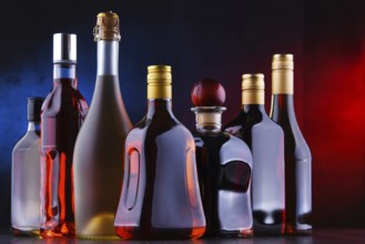 Composition with bottles of assorted alcoholic beverages