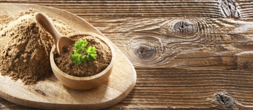 Composition with a bowl of ground coriander