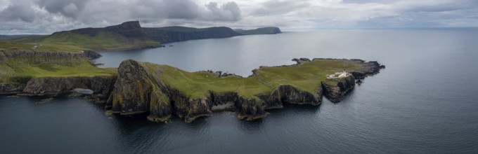 A panorama drone view of the Neist Point Lighthouse and the Minch on the western coast of Isle of