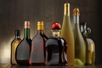 Composition with bottles of assorted alcoholic beverages