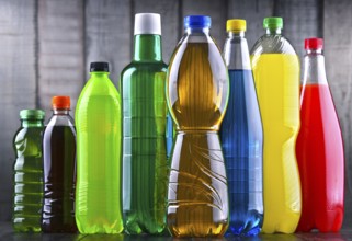 Plastic bottles of assorted carbonated soft drinks in variety of colors