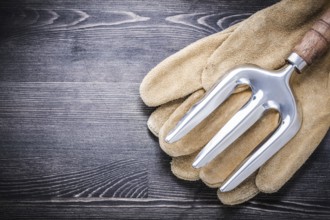 Stainless steel trowel fork leather protective gloves gardening concept