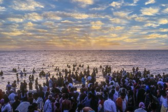 Devotees taking a dip in the holy waters of the Agni Theertham in Rameswaram, Tamil Nadu, South