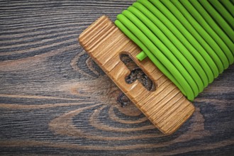Garden tie wire on wooden board gardening concept