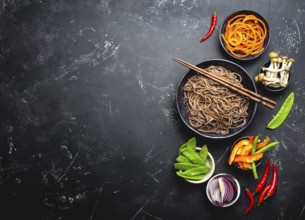 Ingredients for making stir-fried noodles soba. Cut fresh vegetables, mushrooms, boiled soba