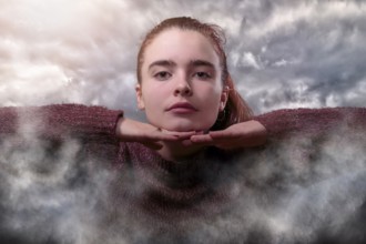 Composition, young woman in the clouds