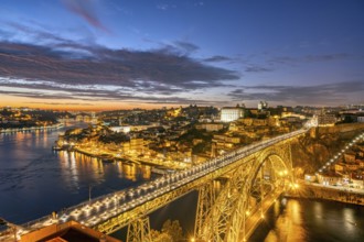 Porto with the Dom Luis I bridge and the Douro river after sunset