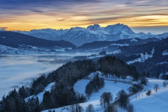 Dreamlike winter landscape at sunset with a view from the Allgäu Alps over the Bregenzerwald in