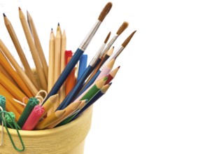 Different office supplies over the white background